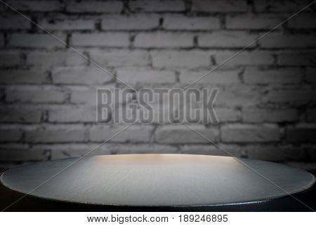 Selected focus empty black wooden table and wall texture or old black brick wall blur background image. for your photomontage or product display.