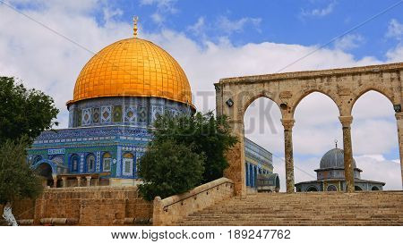 Tourists at the Dome of the Rock in Jerusalem on the top of the Temple Mount. Golden Dome is the most known mosque and landmark in Jerusalem.