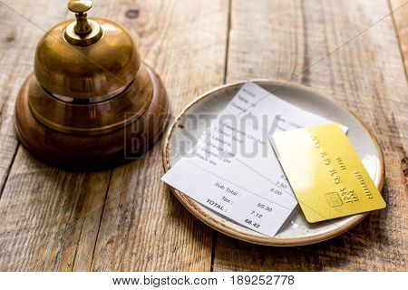 Restaurant Bill Paying By Credit Card And Ring On Wooden Table Background
