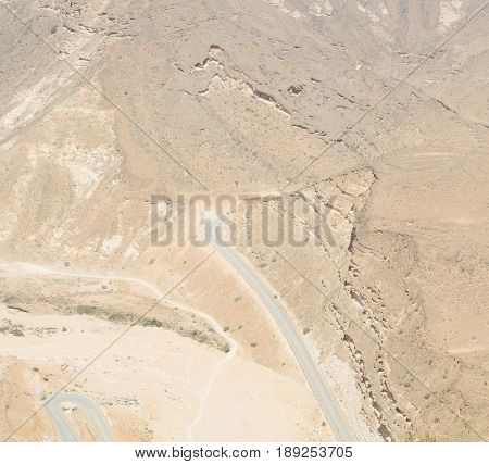 In Oman  The Old Mountain Gorge And Canyon The Deep Cloudy  Sky
