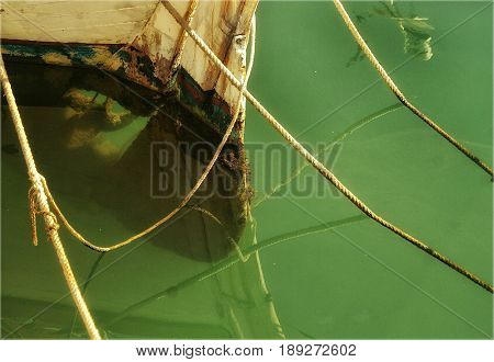Detail of the keel of an old boat in a port of the mediterranean sea