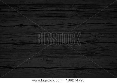 Black wood; a texture and/or background concept
