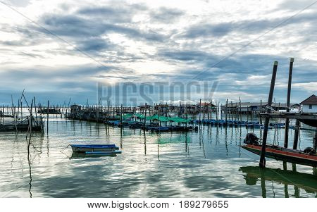 Homestay and floating basket in lake at Kohyo Songkhla Thailand with beautiful sky and clouds. This is traditional fisheries area.