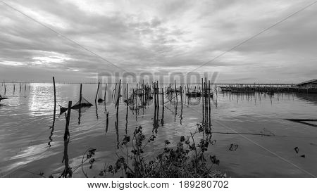 Homestay and floating basket in lake at Kohyo Songkhla Thailand with beautiful sky and clouds. This is traditional fisheries area.