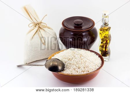 The Composition Of Rice Groats In A Clay Pial Next To A Clay Pot And A Copper Spoon,