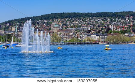 Zurich, Switzerland - 26 May, 2016: Lake Zurich, the city of Zurich in the background. Lake Zurich is a lake in Switzerland, extending southeast of the city of Zurich, which is the largest city in Switzerland.