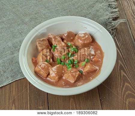 Schweinegulasch - German goulash in sauce. close up
