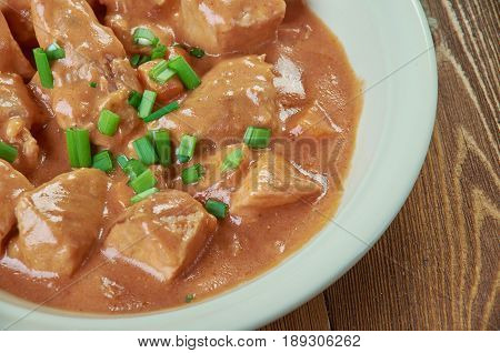 Schweinegulasch - German goulash in sauce. close up