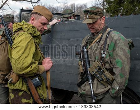 Gatchina, Russia - May 7, 2017: Historical reconstruction of the battles of World War II. The participants of the reconstruction in the form of Soviet and German armies.