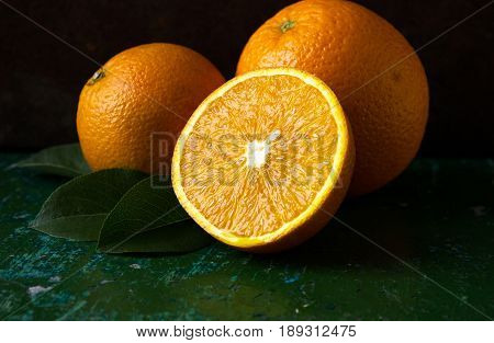 Orange fruit. Orange slices half orange whole orange dark background