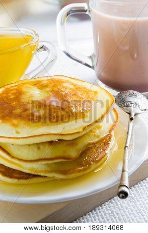 Mug With Cocoa, Honey And Pancakes For Dessert