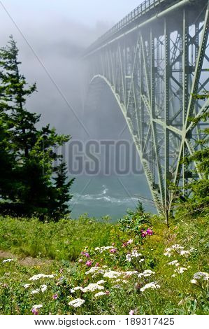 Deception Pass Bridge in fog. Arch bridge. Deception Pass State Park. Puget Sound. Juan de Fuca Strait. Whidbey Island. Seattle. Washington. United States.