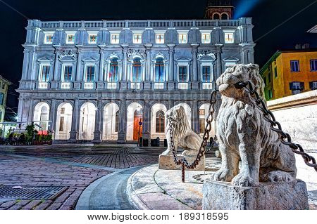 Piazza Vecchia, Citta Alta, Bergamo, Italy. Night view on the square with the beautiful fountain in the center of the square illuminated by night lights.