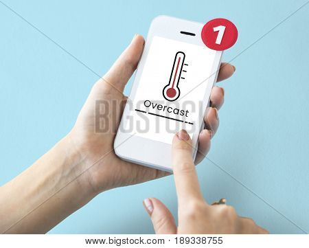 Hands working on digital device network graphic overlay