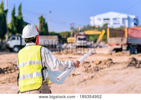 Asian Construction Engineer Checking Construction Site For New Infrastructure Project. Photo Concept