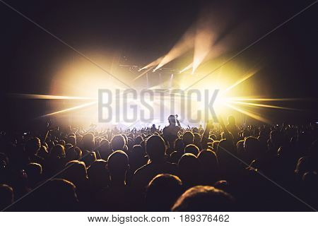 View Of Rock Concert Show In Big Concert Hall, With Crowd And Stage Lights, A Crowded Concert Hall W