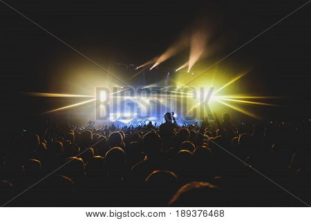 View Of Rock Concert Show In Big Concert Hall, With Crowd And Stage Lights, A Crowded Concert Hall W