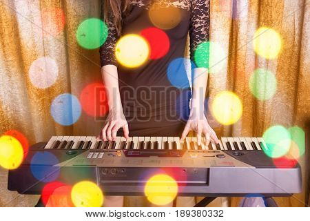 Unrecognizible Girl Musician Playing On Electronic Piano
