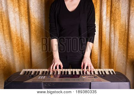 Unrecognizible Girl Musician Playing On Electronic Piano