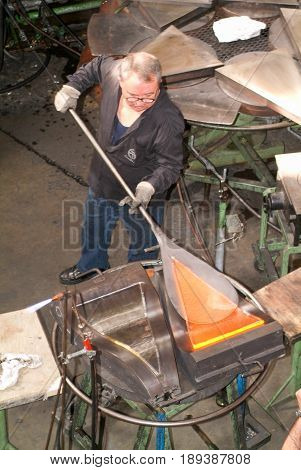 Worker During The Glass Processing