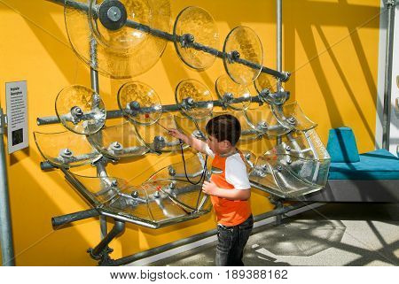 Child Making Music With Glasses
