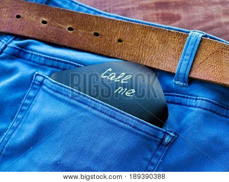 The Phrase, A Note, Call Me In The Pocket Of My Jeans, Standing On A Wooden Background, Space For Te