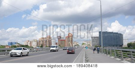 Rostov-on-Don Russia - May 282017: According Voroshilovsky bridge moving cars and pedestrians
