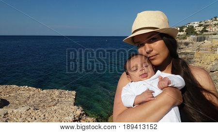 mum and baby on the beach, Malta, Mellieha