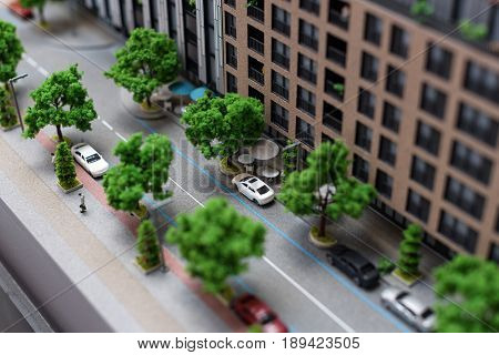 Miniature model, miniature toy buildings, cars and people. City maquette