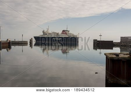 FYNSHAV DENMARK - MAY 7 2017: AlsFAERGEN ferry leaves port on may 7 2017 in Fynshav Denmark. The ferry connects Fynshav with Bojden in Denmark.