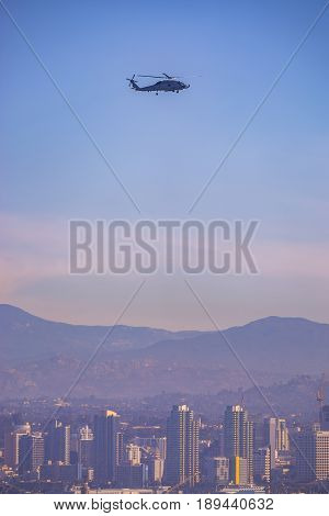 Helicopter hovering over the city and the bay