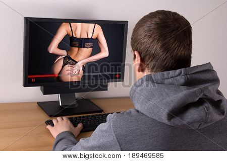 man watching erotic video with young beautiful sexy woman in lingerie