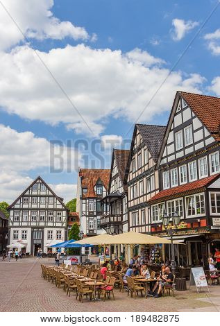 RINTELN, GERMANY - MAY 22, 2017: People at a cafe on the central market square of Rinteln, Germany