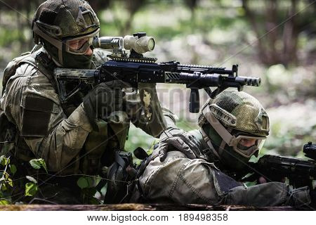 Soldiers in military operation at woods during day