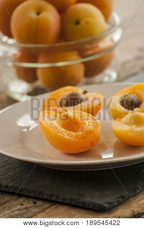 sliced apricots isolated on black background close up