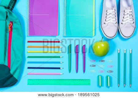Flat Lay With Various School Supplies On Colorful Surface