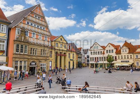 HAMELN, GERMANY - MAY 22, 2017: People shopping at the colorful central market square of Hameln, Germany