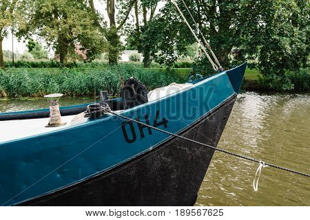 Monnickendam Netherlands - August 08 2016. Ship moored in the canal of Monnickendam. The town was founded by monks and it is a small fishing village today