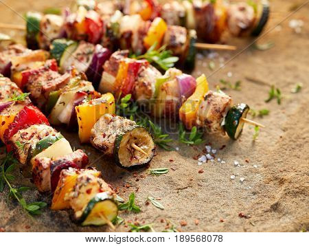 Grilled meat and vegetable skewers with fresh herbs and spices
