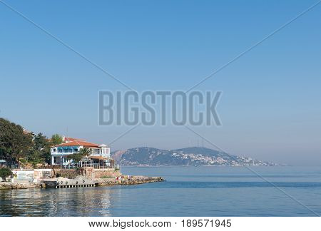 Istanbul, Turkey - April 27, 2017: View of Burgazada island from the sea showing a summer house. The island is the third largest one of four islands named Princes' Islands in the Sea of Marmara near Istanbul Turkey