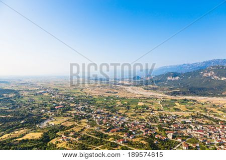 View of the red roofs of the Kalambaka town from the Meteora rocks, Greece.Red roofs of Kalambaka town from Meteora rocks, Greece