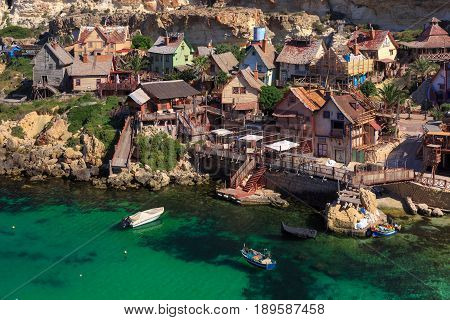 Traditional colorful houses in the famous Popeye Village at Anchor Bay, Il-Mellieha, Malta