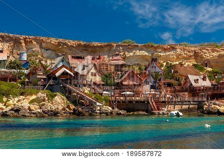 Traditional colorful houses in the famous Popeye Village at Anchor Bay, Il-Mellieha, Malta