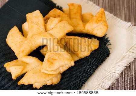 Closeup of delicious ecuadorian pristinos, piled up fresh from the fryer, traditional andean pastry suitable for coffee meetings.