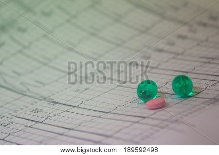 Holter electrocardiogram trace of a patient with pacemaker and some colored pills