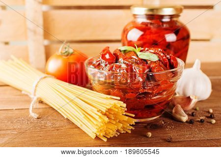 Italian Spaghetti With Ingredients For Cooking Pasta On A Wooden Table