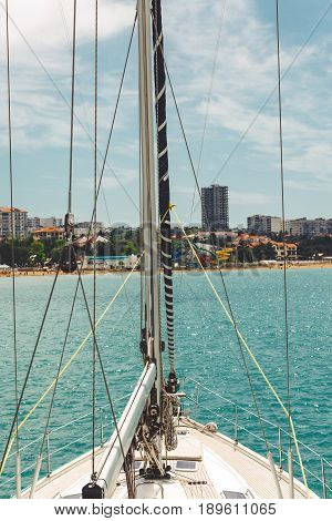 Yacht in the sea. The yacht's nose on the azure sea water Concept of travel and sea walks