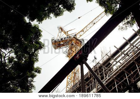 A construction crane with blue sky background