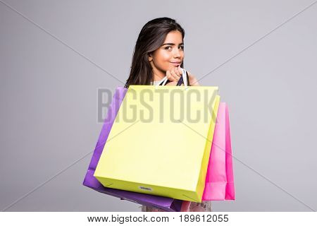 Shopping Woman Holding Bags, Isolated On Gray Background.