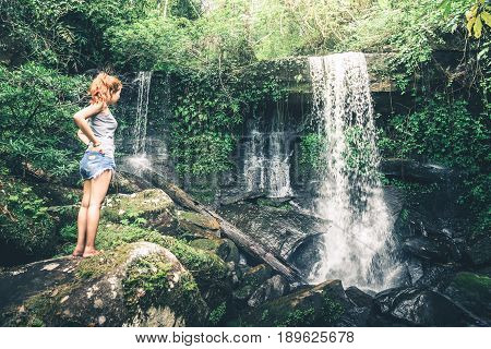 woman asia travelers travel. Walking hand travelers travel nature Forests mountains waterfalls. puhinrongkla romklao-paradorn waterfall